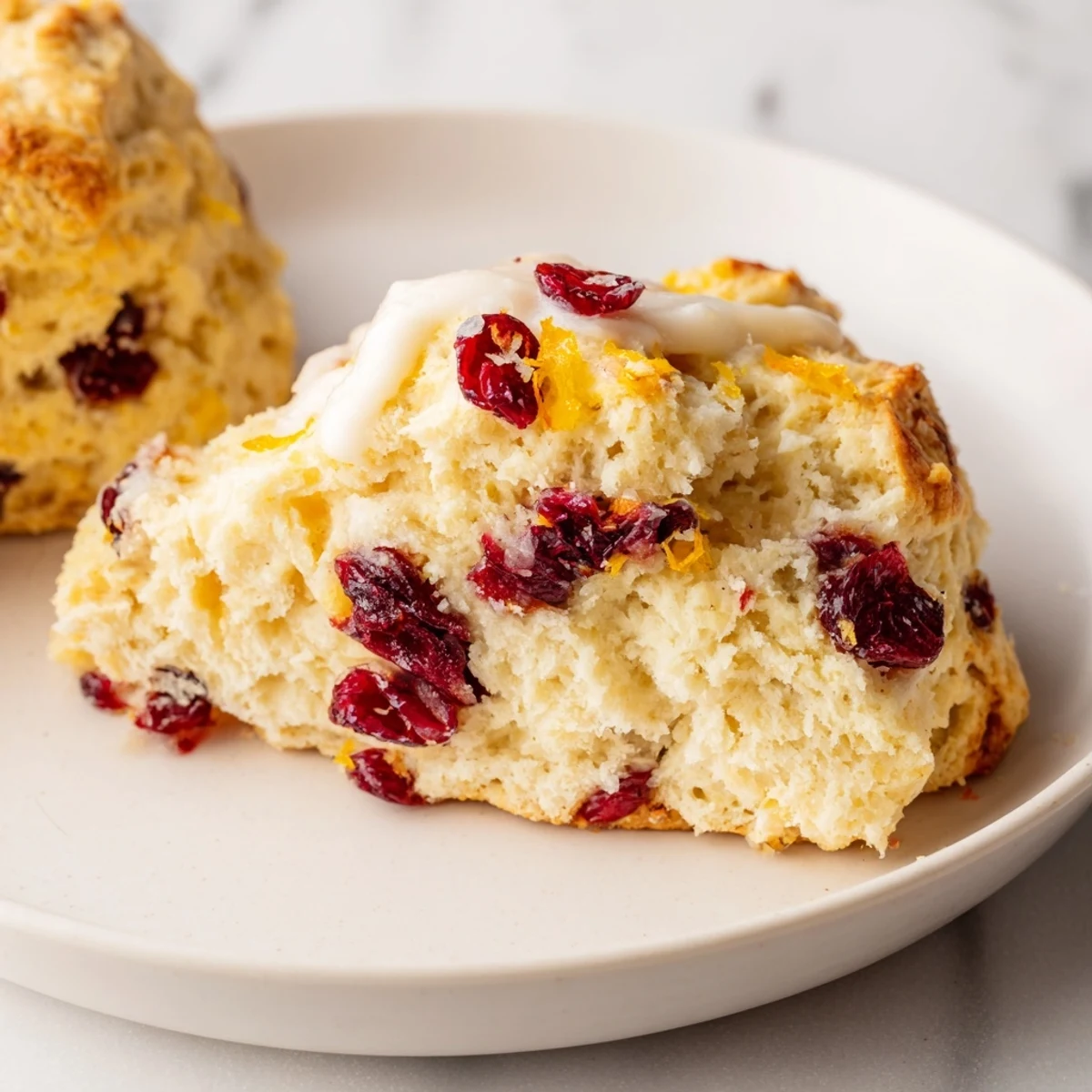 Fluffy cranberry scones, golden brown and ready to eat, perfect for breakfast or brunch.