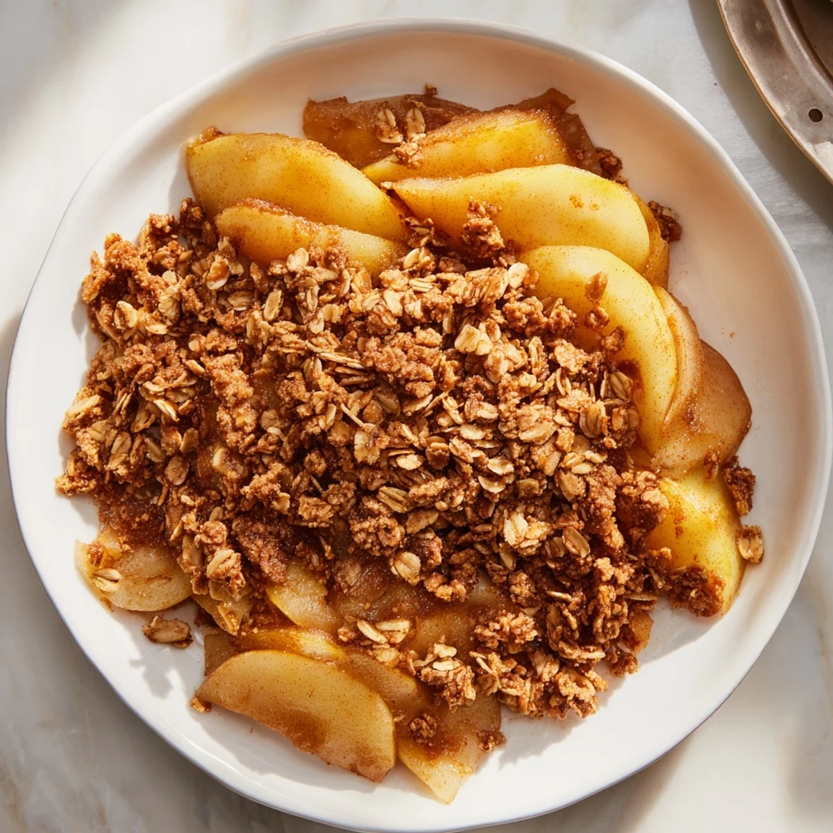 Close-up photo of a freshly baked Spiced Pear Crisp, fragrant and bubbling from the oven.