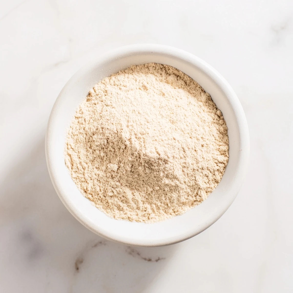 Close your eyes and see the deep golden hue of homemade garlic powder, ready to season.