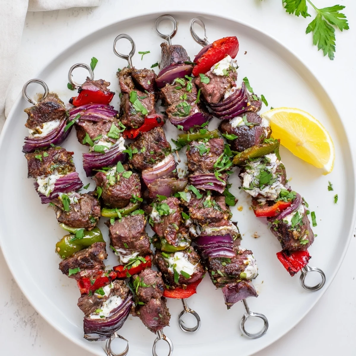 Freshly grilled lamb kebabs with colorful veggies offer a delicious Middle Eastern meal suggestion.