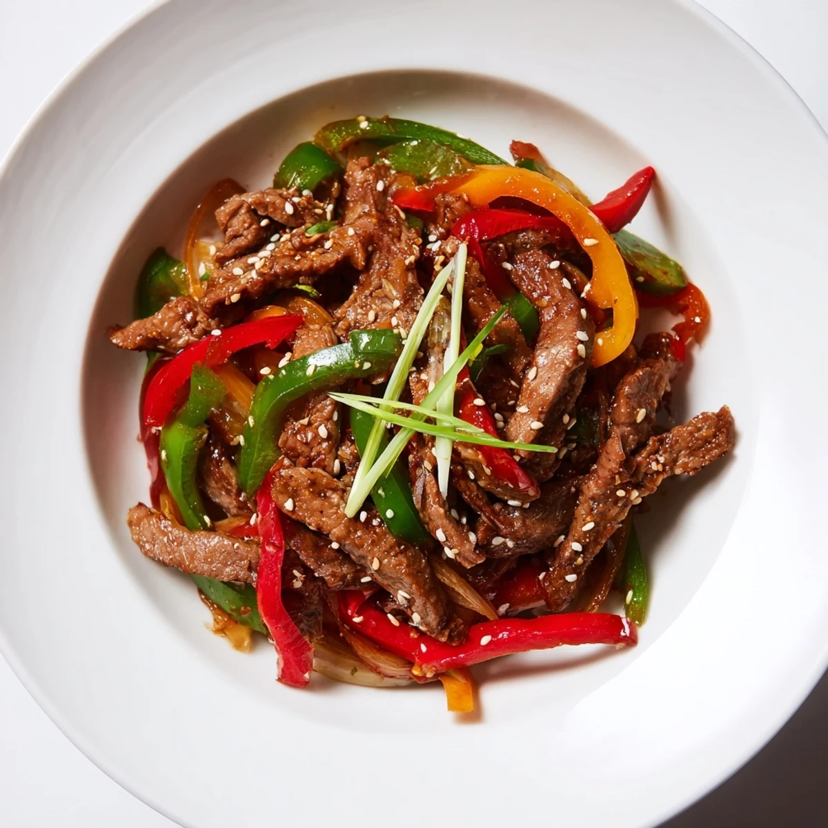 Tender beef and colorful bell peppers in a flavorful Spicy Beef and Pepper Stir Fry, ready to enjoy.